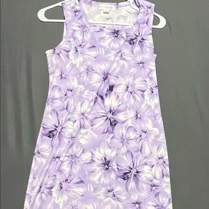 a purple, floral, graphic dress. has a square neck line.